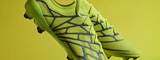 umbro-velocita-alchemist-studio-holding-boots